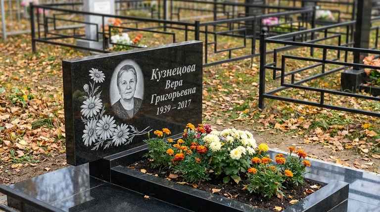 Памятник с гравировкой ромашек — выполненная работа «Кузнецова» в Магнитогорске