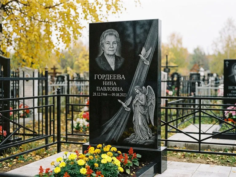 Памятник с гравировкой ангела — гравировка ангела с голубем по диагонали стелы, работа «Гордеева» в Магнитогорске